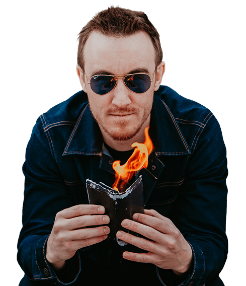 A man in sunglasses holding a burning notebook, with flames rising from it.